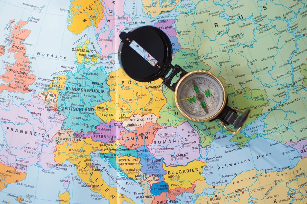 A map of Europe with a compass resting on it