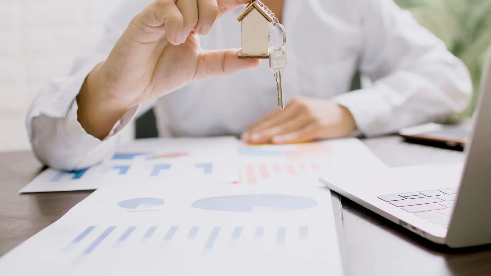 Property keys and paperwork on a desk