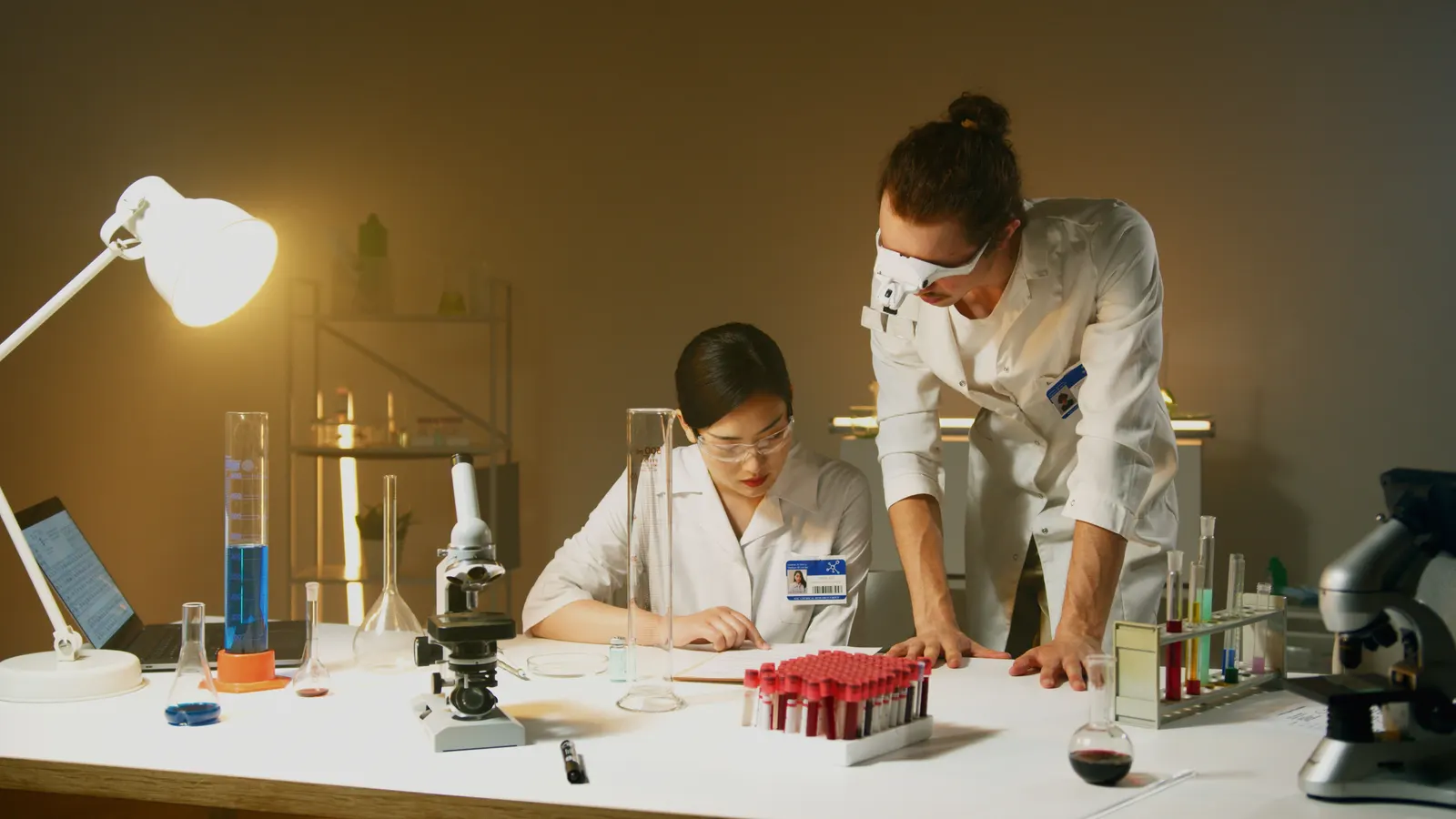Two researchers working together at a laboratory bench